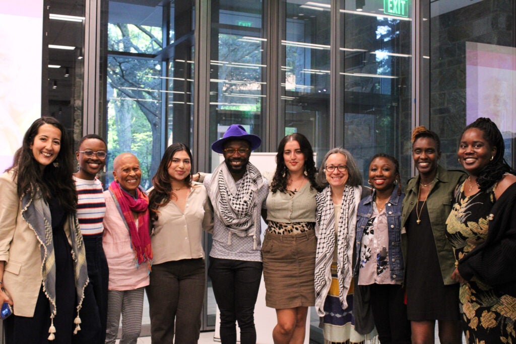 The moderators, faculty and staff pose for a picture with Dr. McFadden.