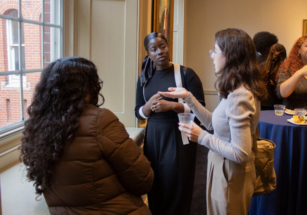 Colloquium attendees enjoy the post-event reception. 