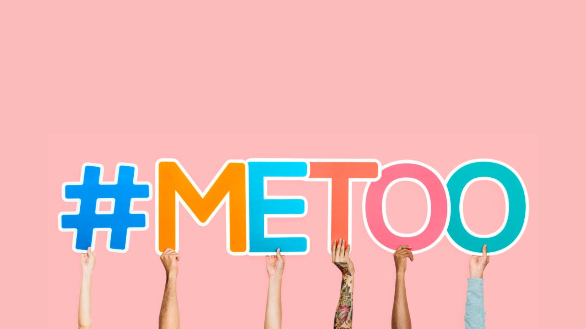 Hands of varying skin tones holding up letters that read #MeToo.
